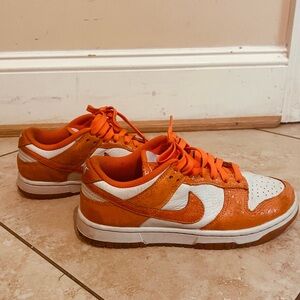 Orange is the new fashion statement! These orange dunks have absolute glam!